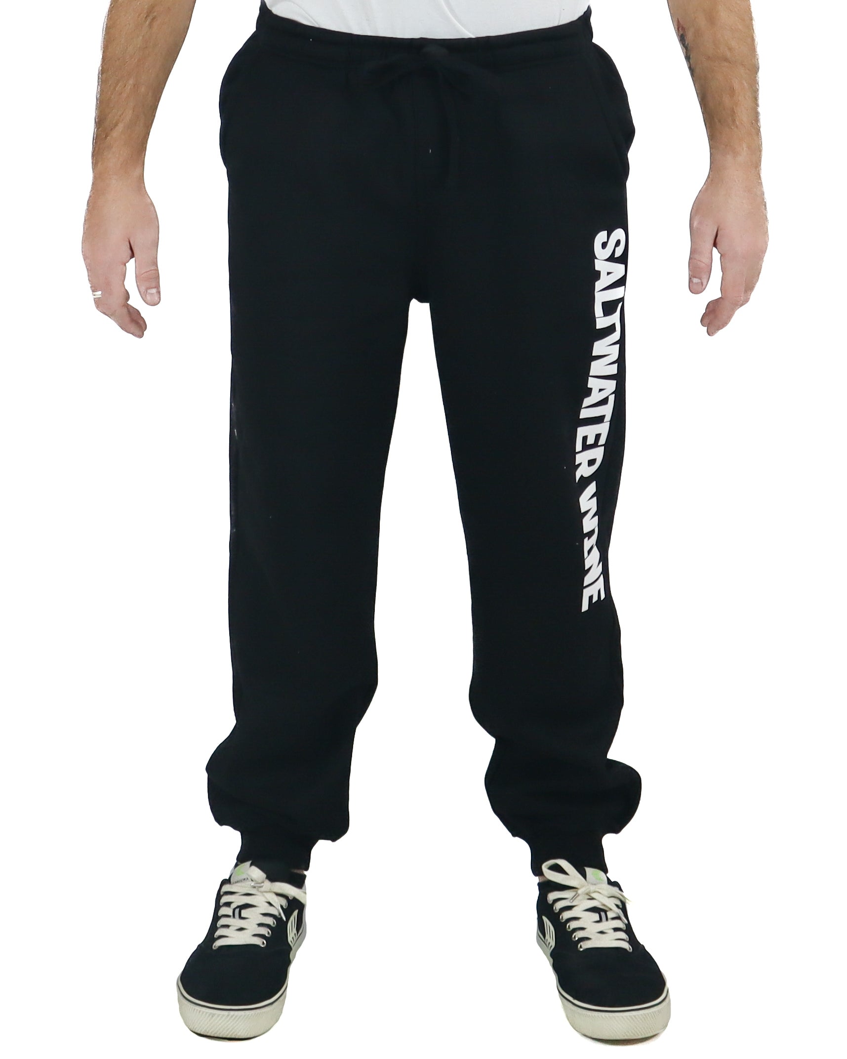 Black track pants with SALTWATER WINE logo printed vertically on left leg
