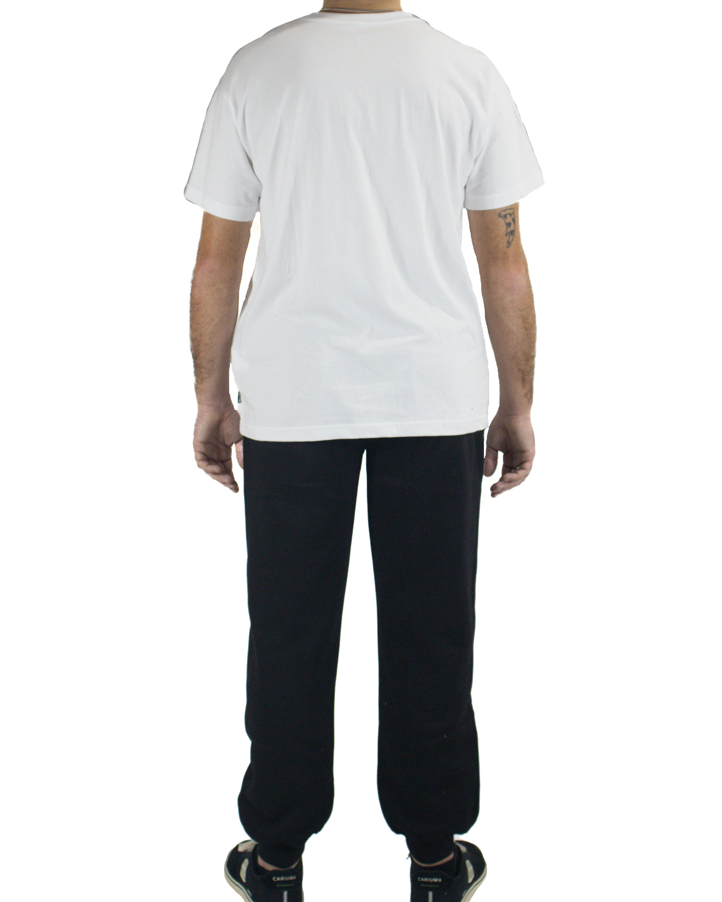 Back view of black cuffed track pants styled with plain white tee