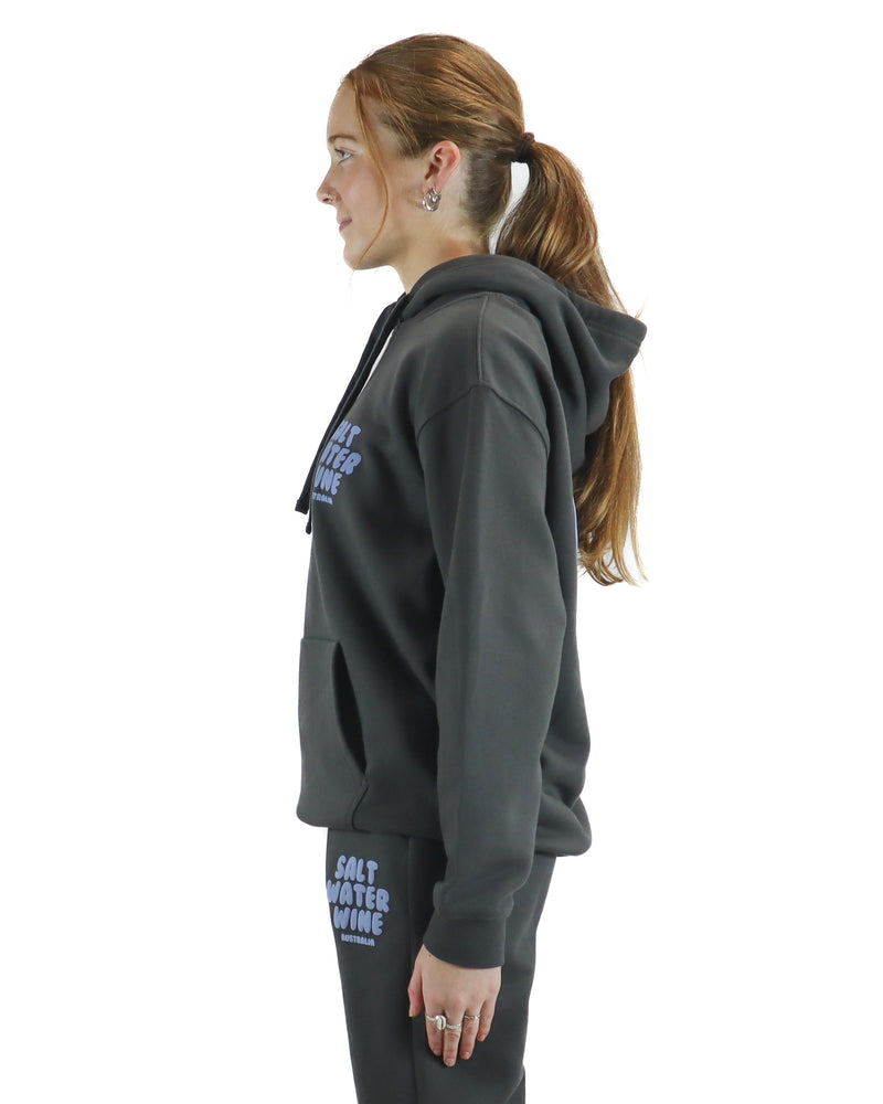 Side view of charcoal hoodie with front Salt Water Wine logo.