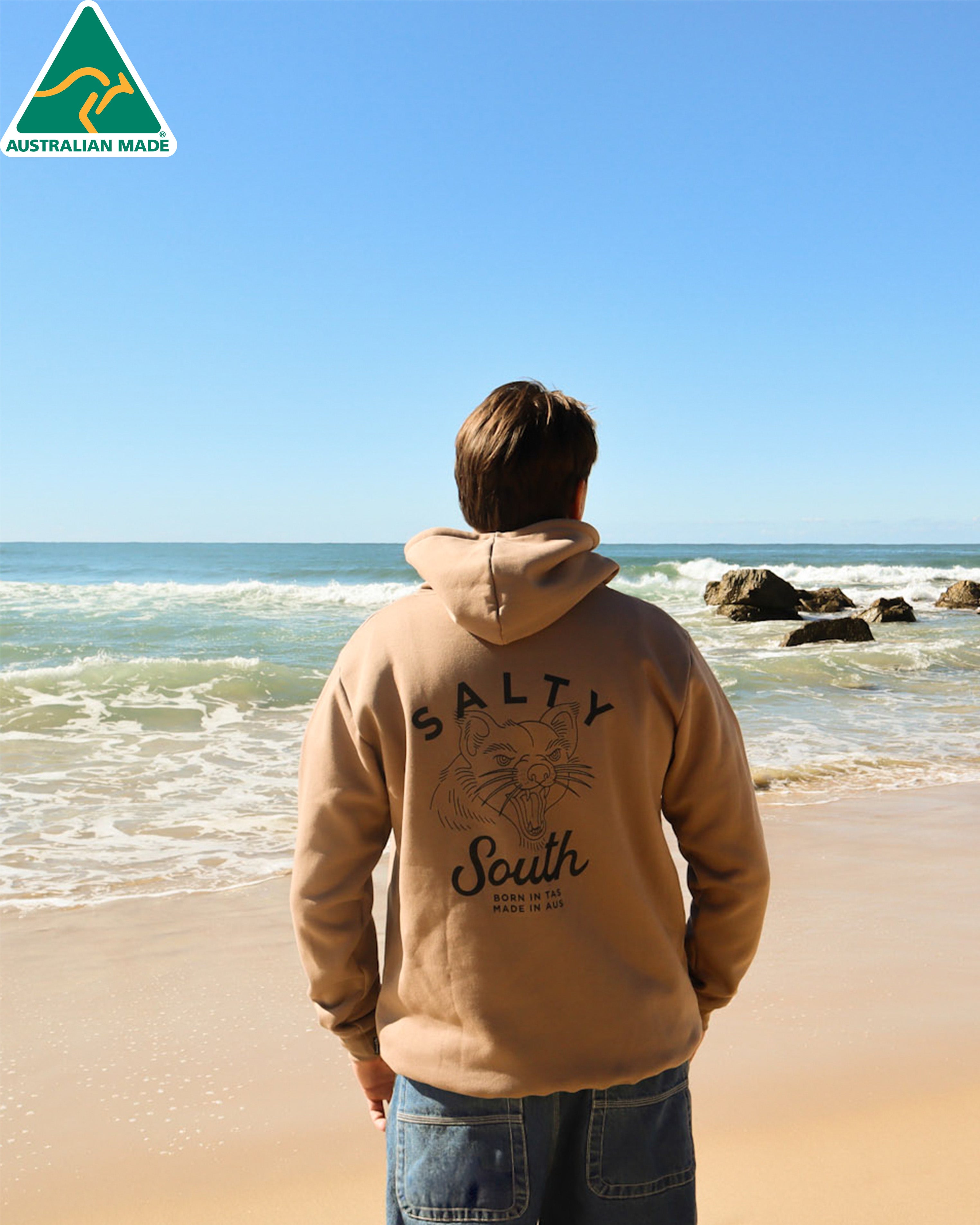 Tan Salty South hoodie with Tasmanian devil graphic and text born in TAS, made in AUS.