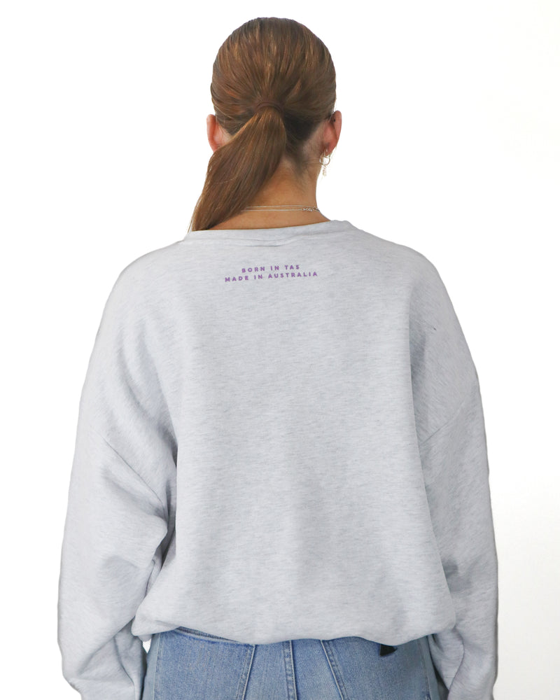 Back view of grey Salty South jumper featuring ‘Born in TAS, Made in Australia’ text beneath the neckline.