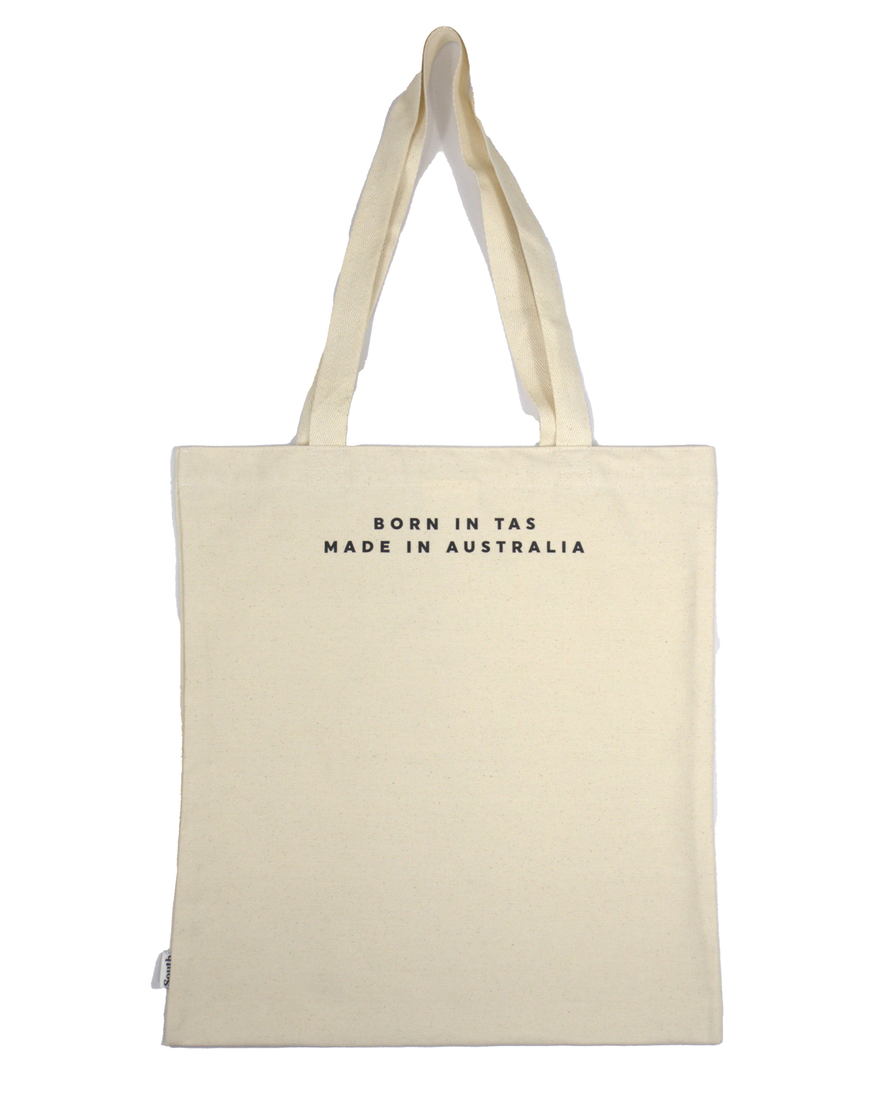 Back view of canvas tote bag with Born in TAS Made in Australia text in minimalist black font