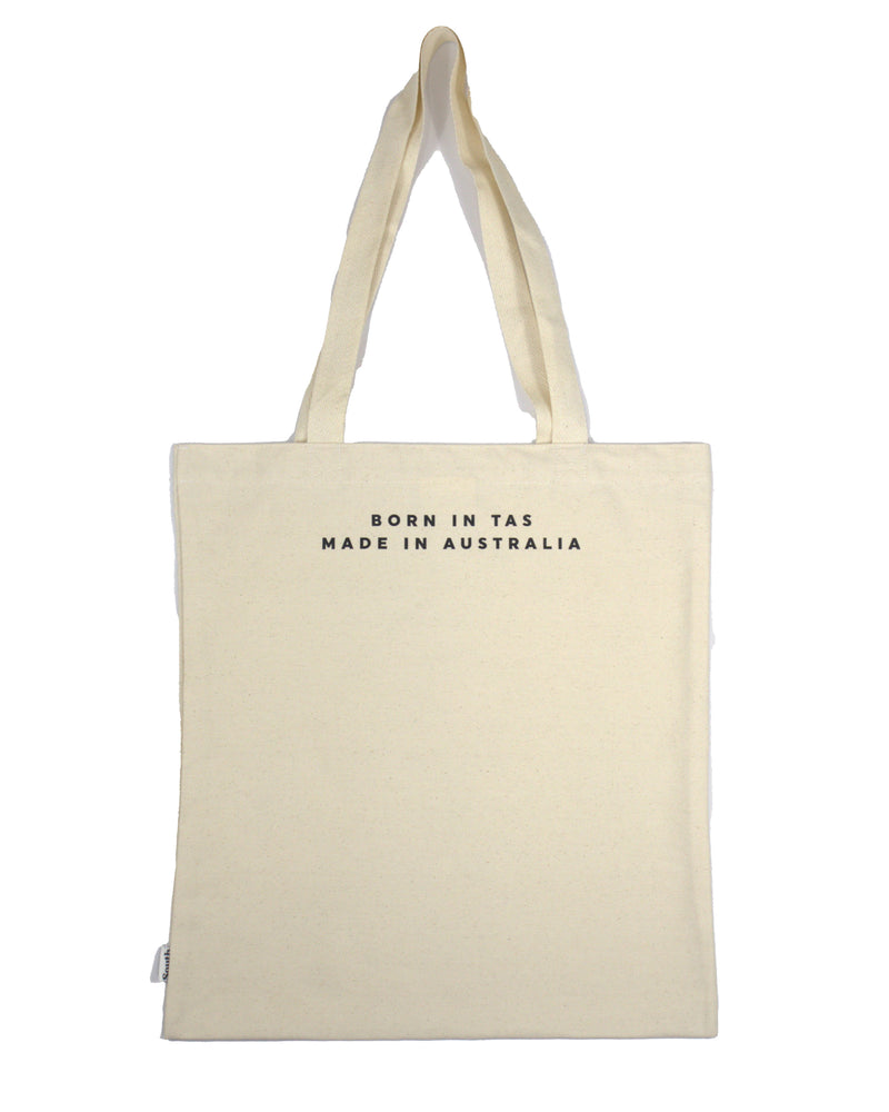 Back view of canvas tote bag with Born in TAS Made in Australia text in minimalist black font