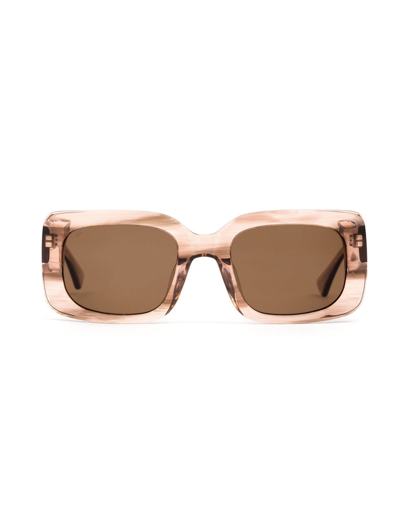 Rectangular sunglasses with a translucent blush-toned acetate frame and brown lenses, shown from the front.