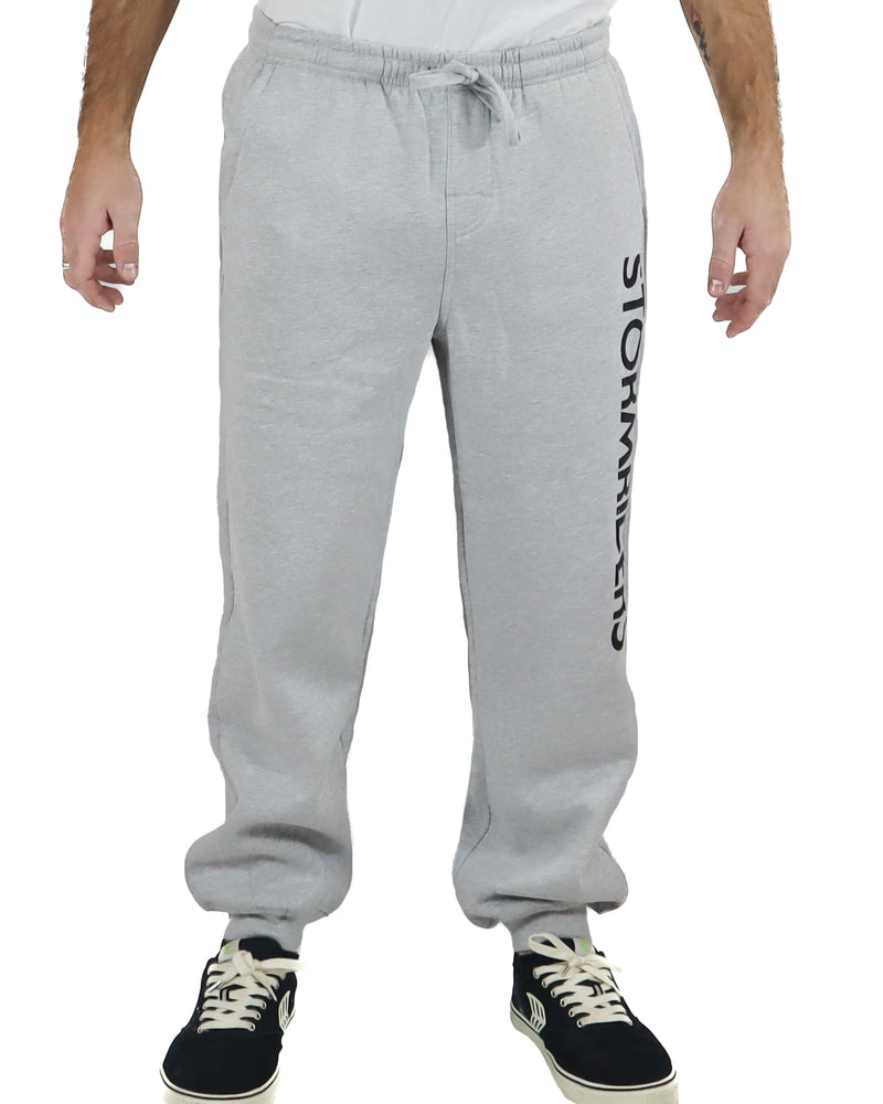 Light grey Stormriders track pants with black logo on the leg.