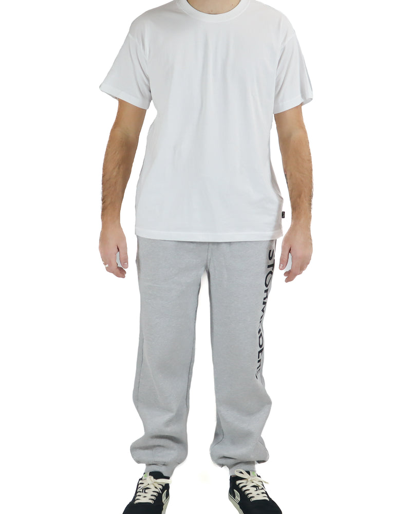 Front view of light grey Stormriders track pants with drawstring waist.