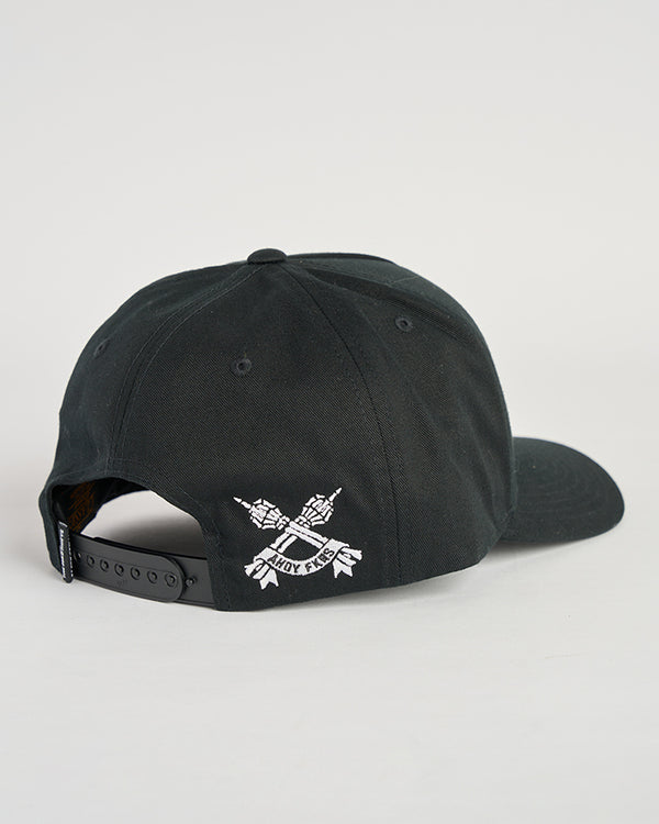 A black baseball cap with adjustable snapback closure, featuring embroidered crossed tridents and "Mad Hueys" text on the back.