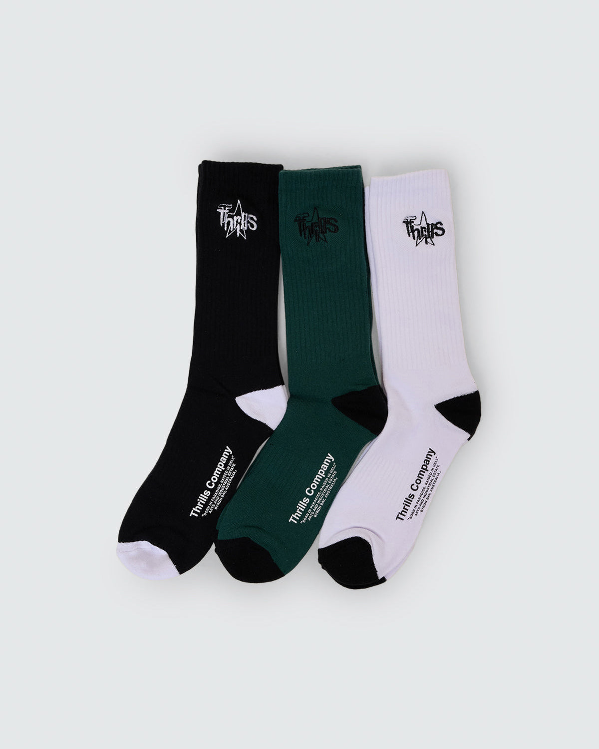 Thrills Company crew socks three pack in black, green and white with logo detailing