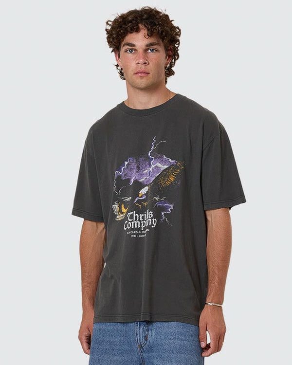 Faded black oversized tee with Thrills Company eagle and lightning graphic on front