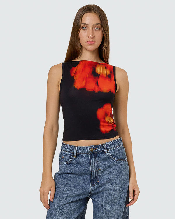 Black sleeveless crop top with bold red and orange floral print