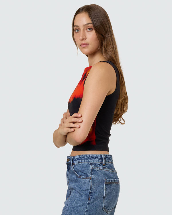 Side view of black sleeveless crop top with red and orange floral design