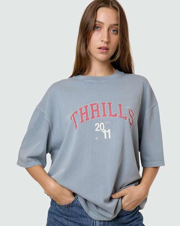 Light blue oversized tee with red Thrills 2011 graphic on front