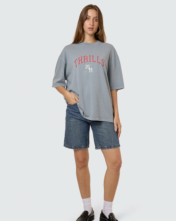 Light blue oversized Thrills 2011 graphic tee styled with denim shorts