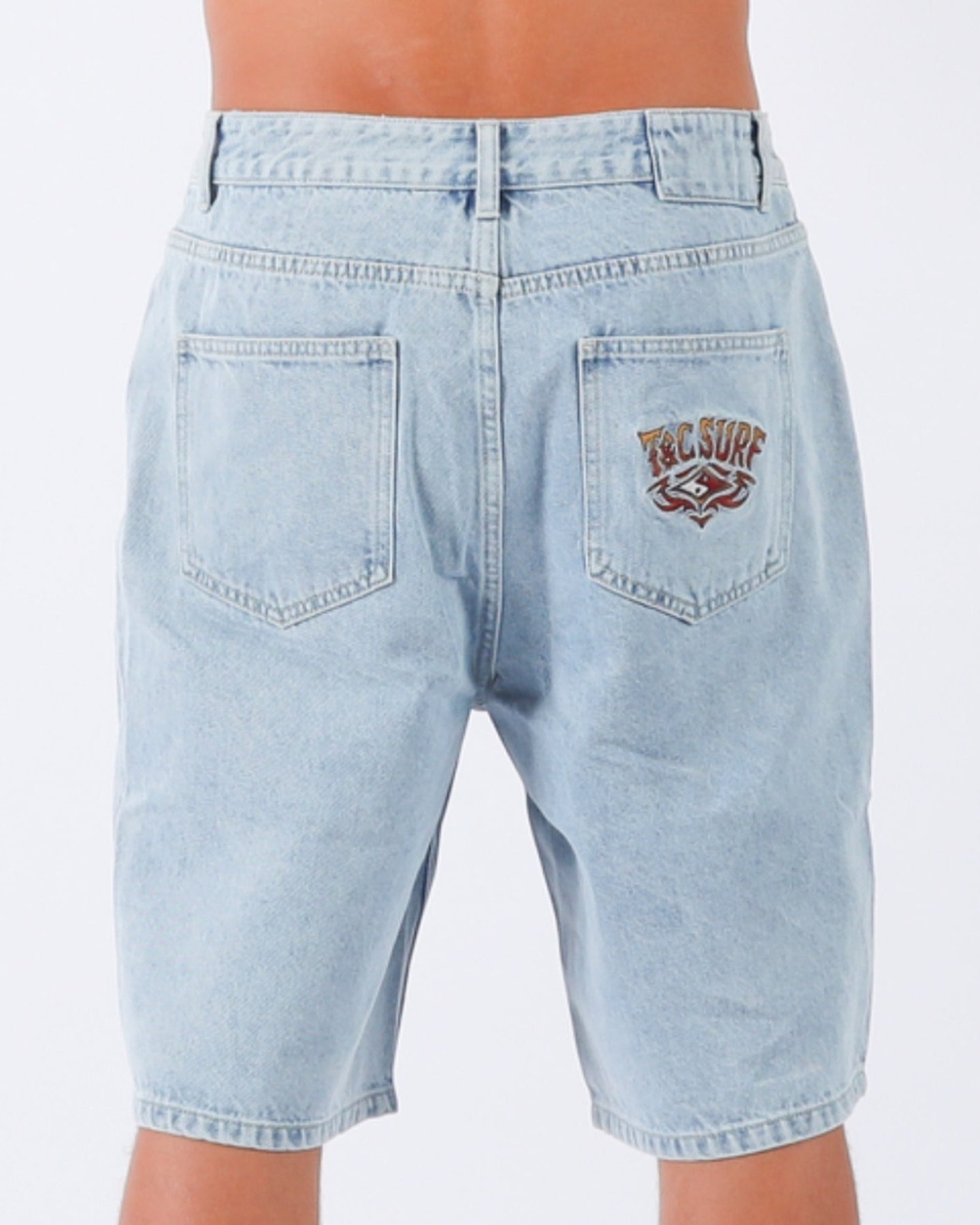 Back view of light blue denim shorts with T&C Surf embroidered logo on pocket