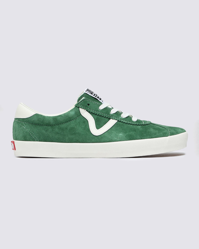 Green suede low-top sneaker with white accents, wavy side stripe, white laces, and a rubber sole, displayed in profile view.