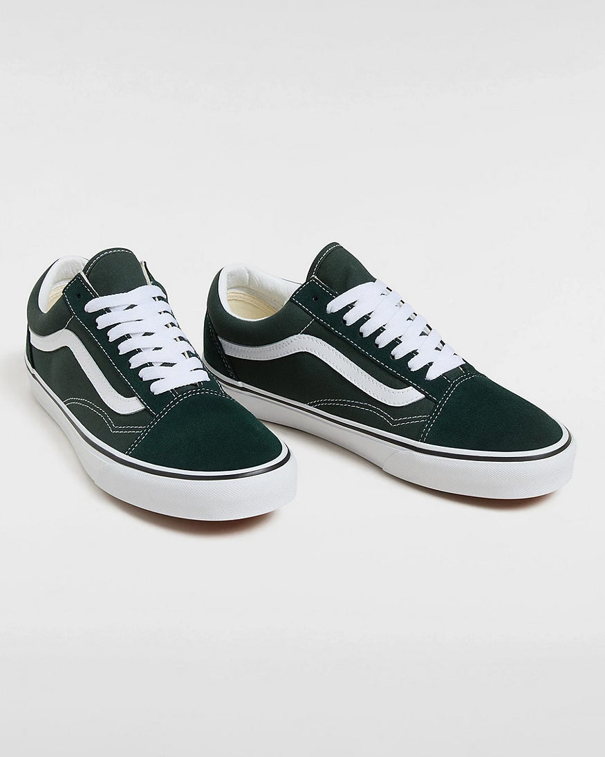 Pair of dark green Vans Old Skool sneakers with white laces, white soles, and signature side stripe, displayed on a white background.