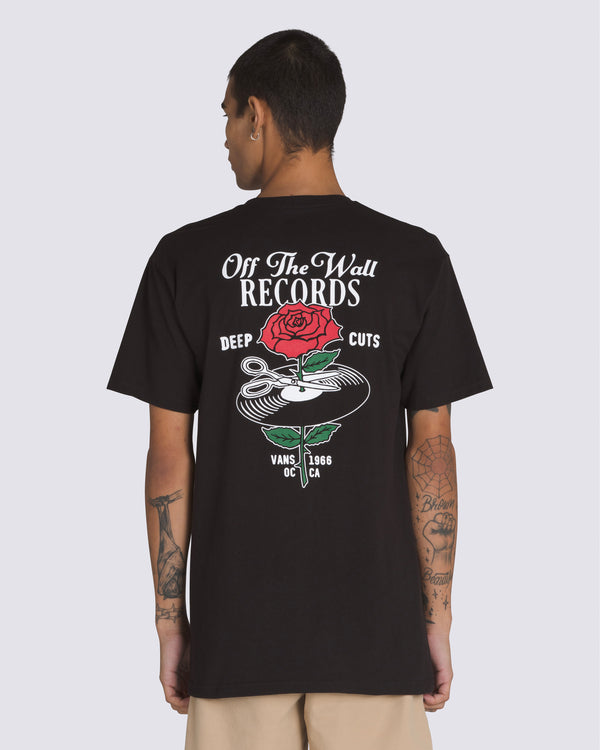 Model wearing a black Vans Off The Wall Records t-shirt featuring a bold back graphic with a rose, vinyl, and scissors design.