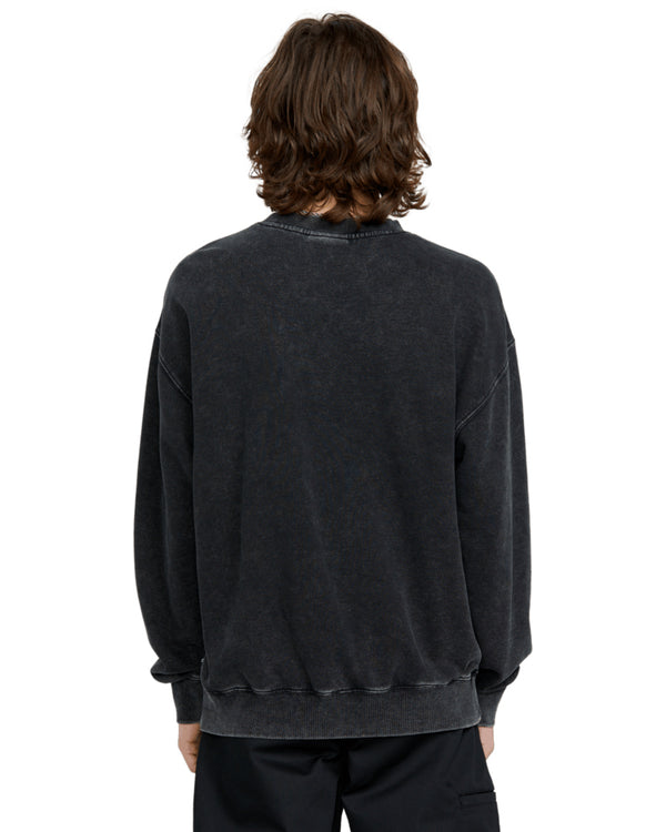 Back view of a male model wearing a black vintage-wash Volcom crewneck sweatshirt with a relaxed fit and ribbed cuffs.