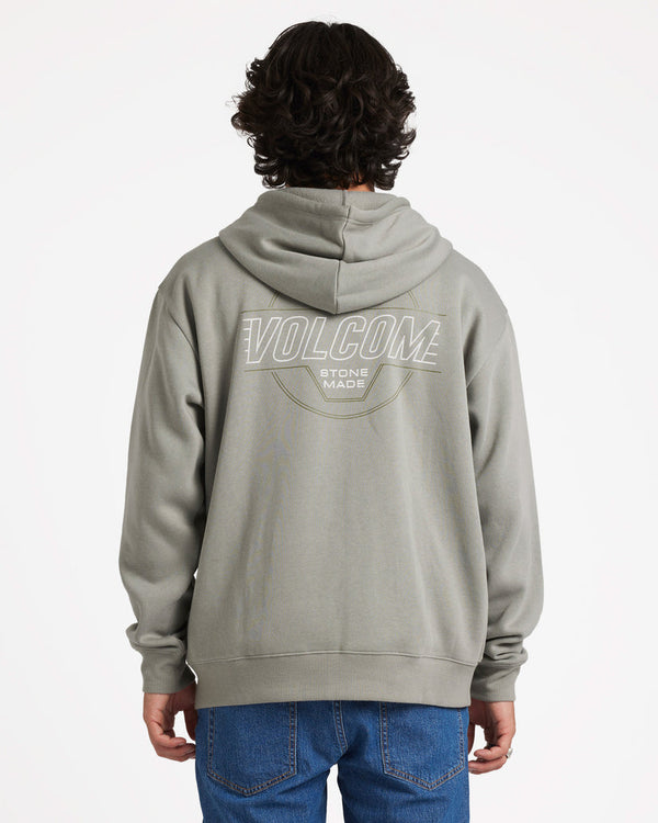 Back view of a model wearing a light grey Volcom zip-up hoodie with a large white 'Volcom Stone Made' graphic on the back.