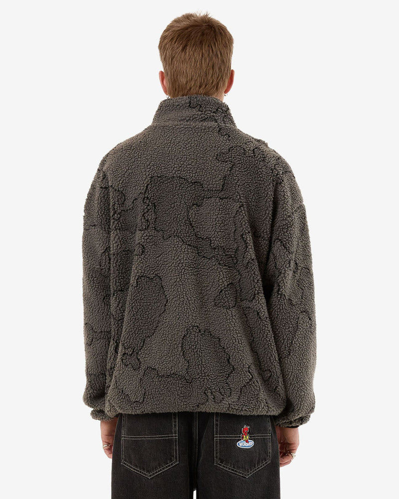 Back view of a men's dark grey sherpa fleece pullover with a subtle camouflage pattern and a high collar for warmth.