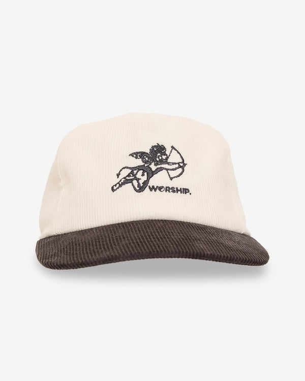 Two-tone corduroy cap with embroidered cherub and "WORSHIP." text on the front, featuring a cream crown and brown brim.