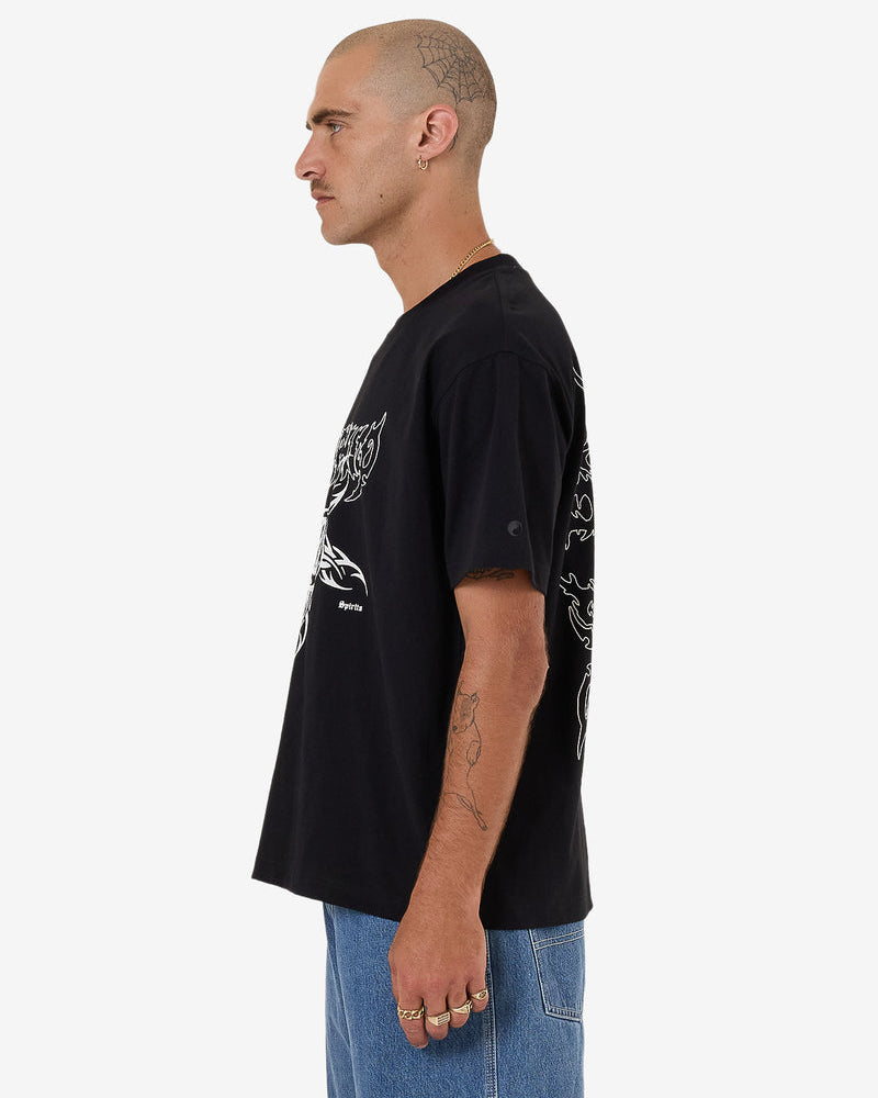 Side view of black graphic tee with oversized graphic print
