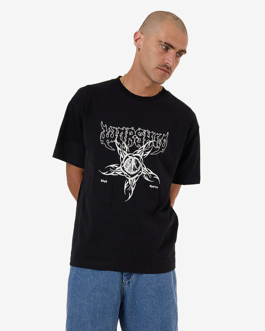 Black graphic tee styled with blue denim jeans for casual look