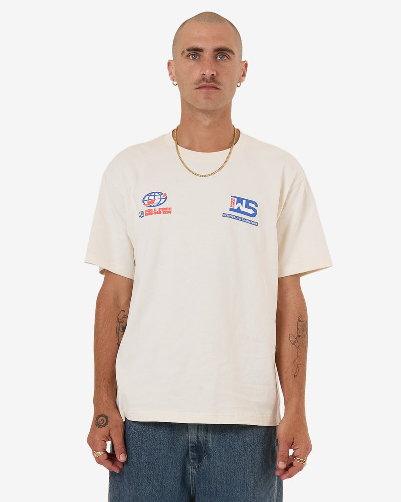 Cream short sleeve T-shirt with small blue and red graphic logos on the chest.