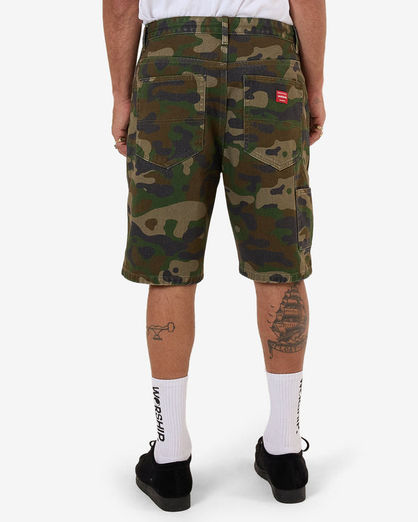 Back view of camo print shorts with patch detail on pocket