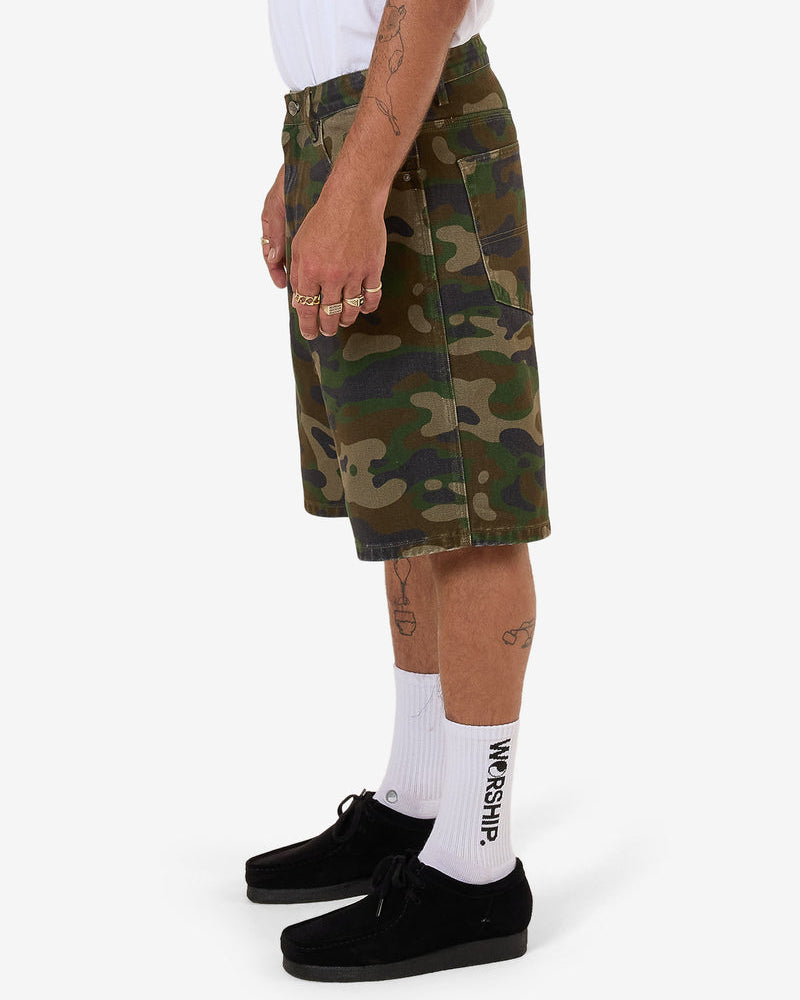 Side view of camo print shorts in classic camouflage design
