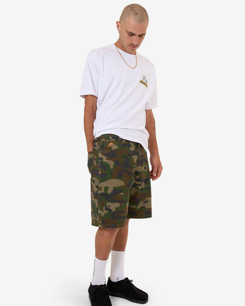 Camo print shorts styled with white tee and black shoes for casual look
