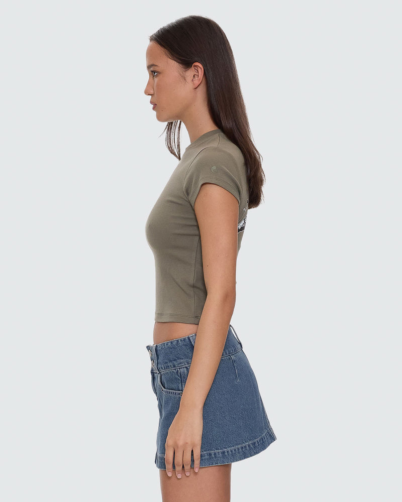 Side view of olive green fitted Worship graphic crop tee