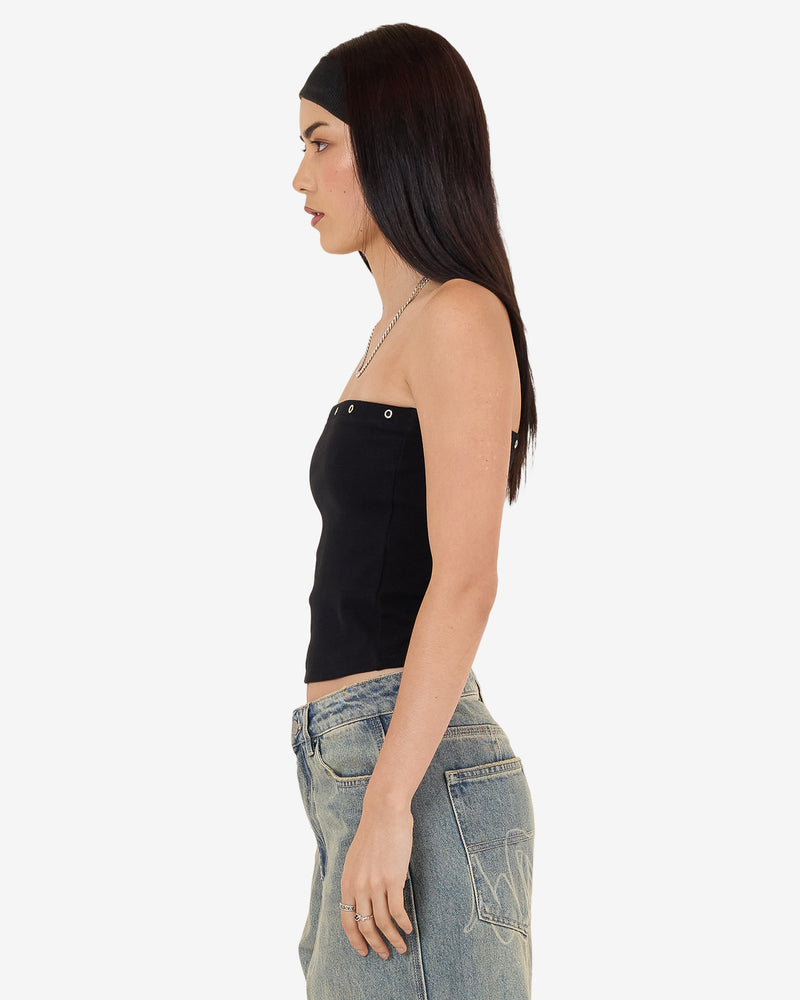 Side view of black strapless tube top with eyelet detail