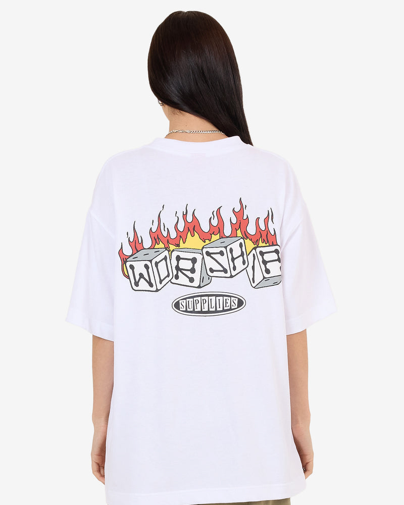 White oversized tee with large flaming dice Worship graphic on back and khaki pants