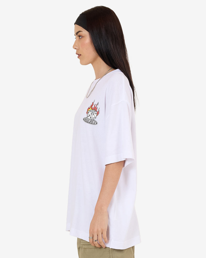 Side view of white oversized tee with flaming dice Worship chest graphic and khaki pants