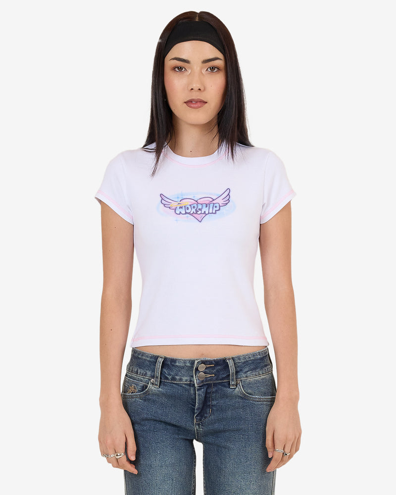 White fitted crop tee with pastel pink trim and Worship winged heart graphic on chest