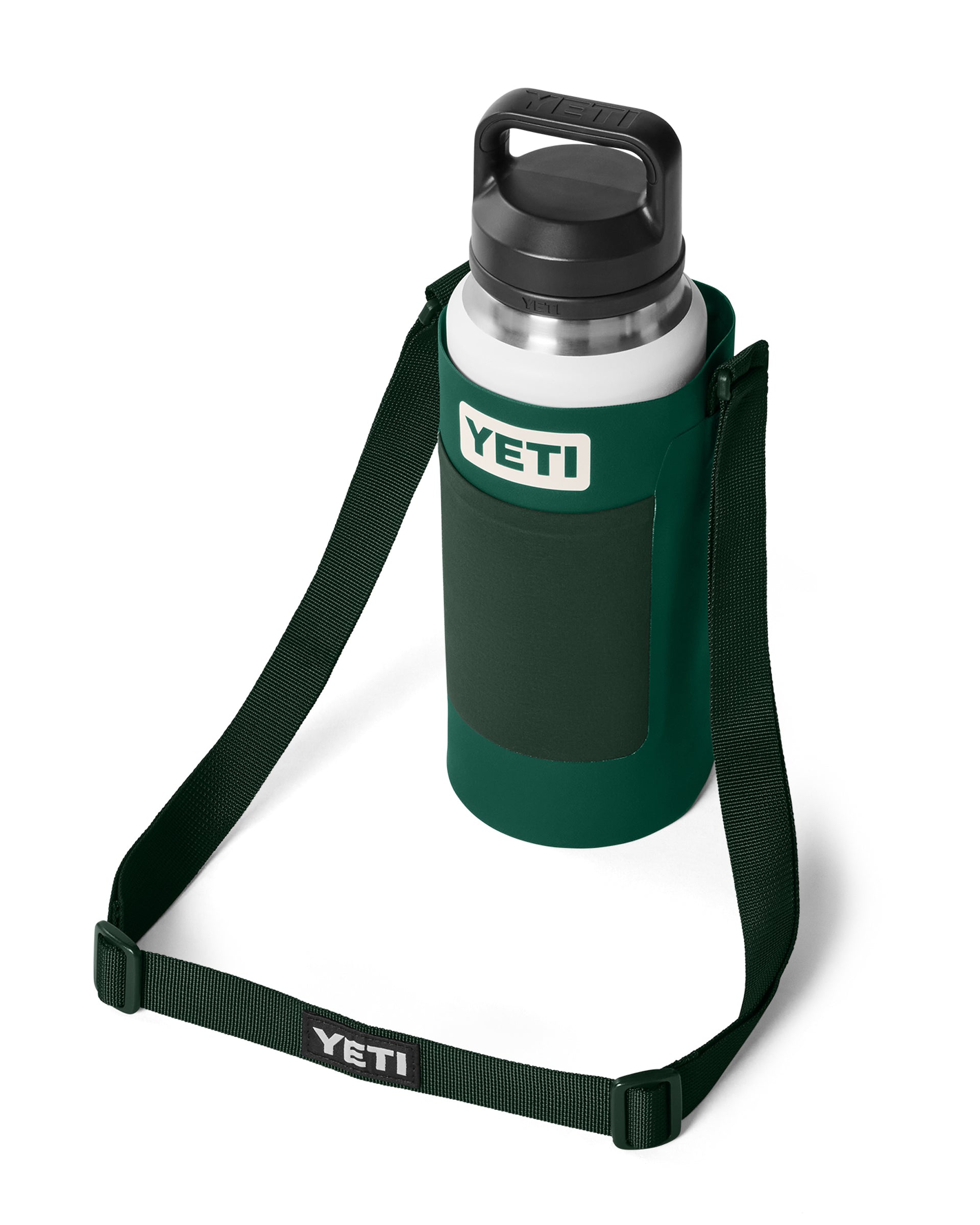 YETI bottle sling with white drink bottle inside, featuring a front pocket and crossbody strap