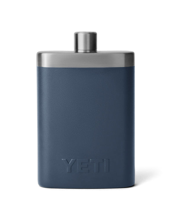 Back view of YETI navy blue stainless steel flask with an embossed logo, screw-on cap, and sleek, durable design for on-the-go use.