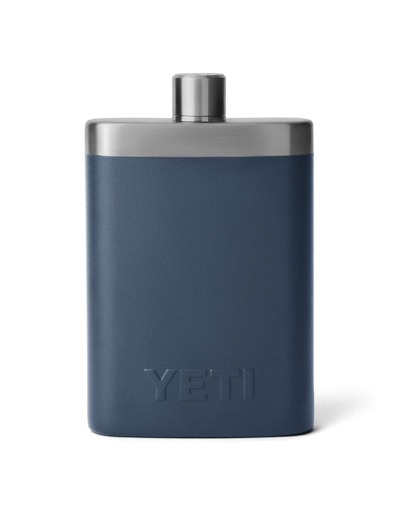 Back view of YETI navy blue stainless steel flask with an embossed logo, screw-on cap, and sleek, durable design for on-the-go use.