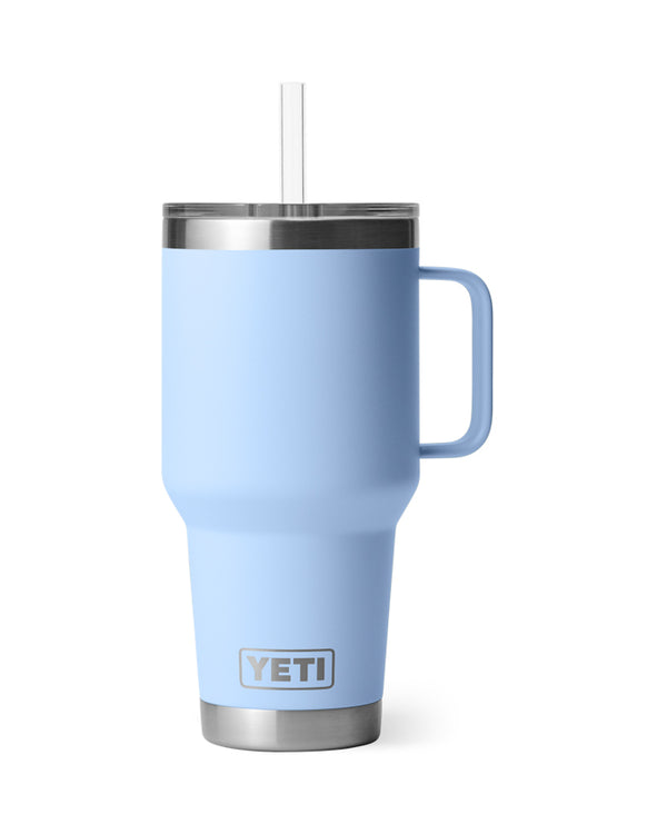 YETI Rambler 35 oz travel mug in light blue with stainless steel base, handle, clear lid, and reusable straw.