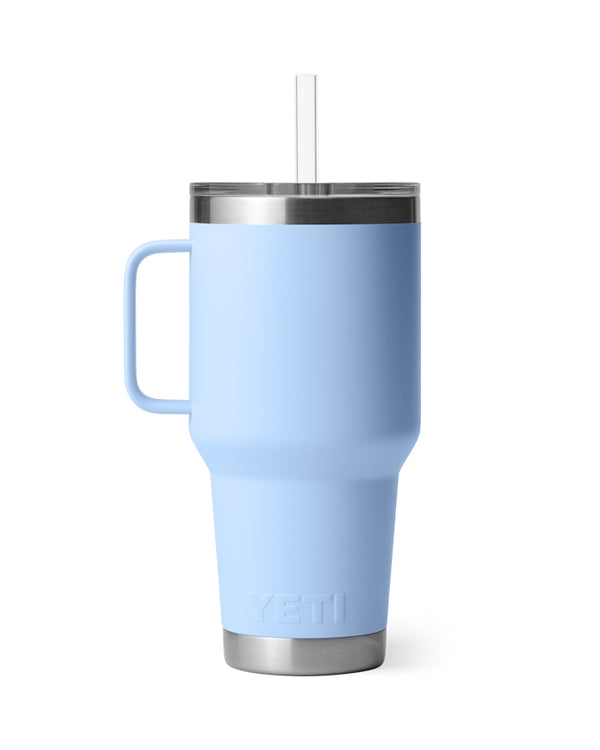 YETI Rambler 35 oz travel mug in light blue with stainless steel base, ergonomic handle, clear lid, and straw.