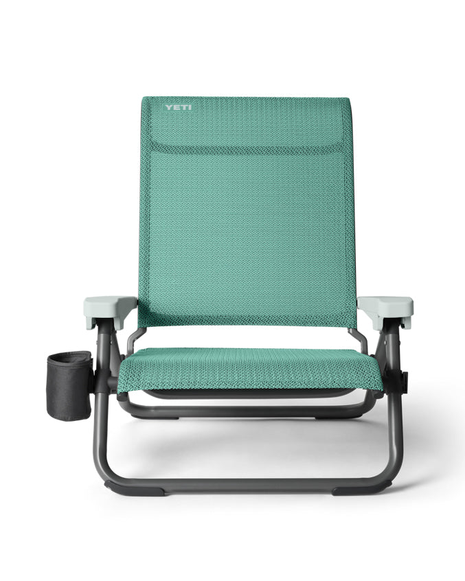 YETI Lowlands camp chair in teal with armrests, cup holder and breathable mesh seat.
